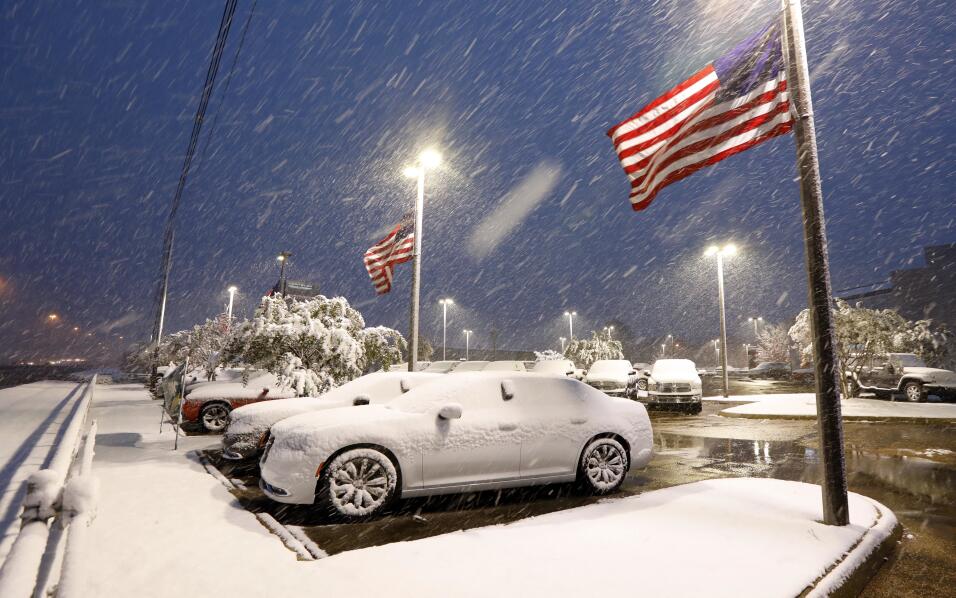 Emmaline Dendinger enjoys a hearty bite of snow in her mid-Jackson, Miss...