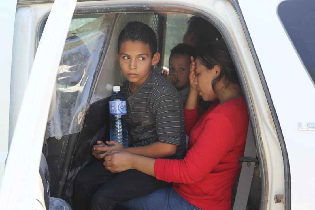 After about 15 minutes, a van arrives to take this group of 7 migrants t...
