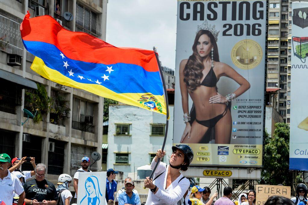 Venezuelan opposition activists march in Caracas on May 6, 2017. Thousan...